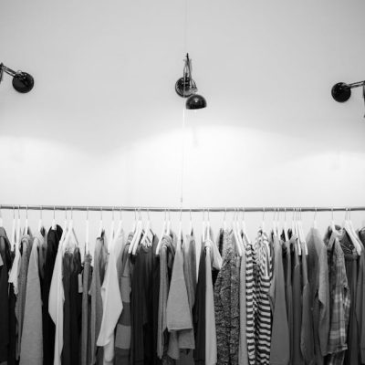 pexels-photo-1884584-1884584 Minimalist black and white clothing display in a stylish boutique setting.